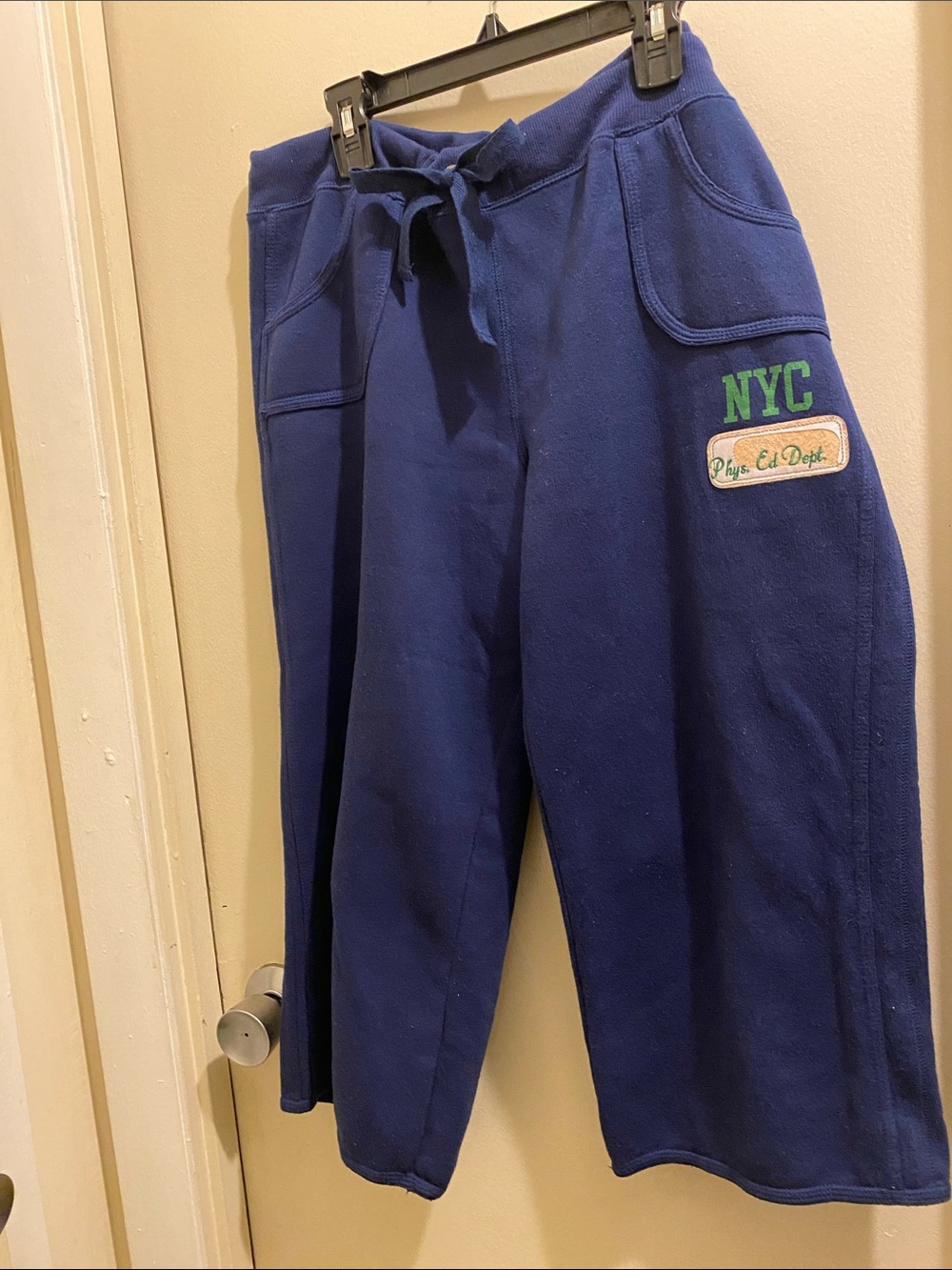 D) Ladies Navy Blue Pull-On Capri Sweatpants with NYC Patch. Junior Lg 11-13